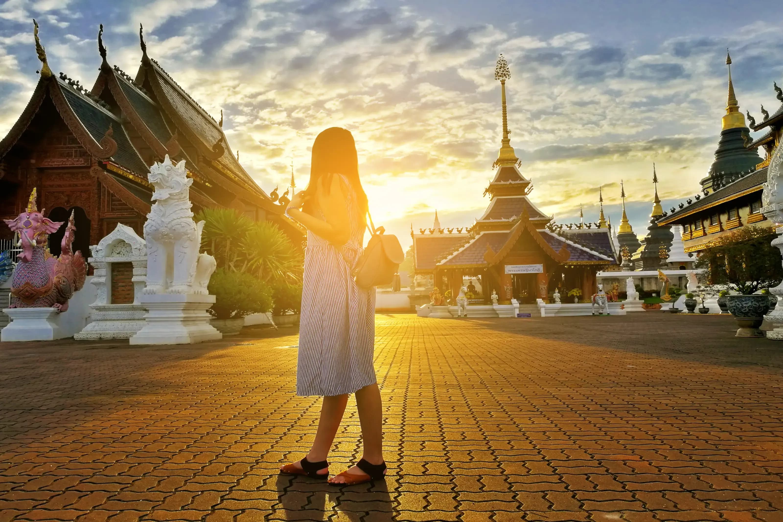 Young asian tourist woman explores Wat Ban Den Buddhist temple located in Chiangmai province, Thailand