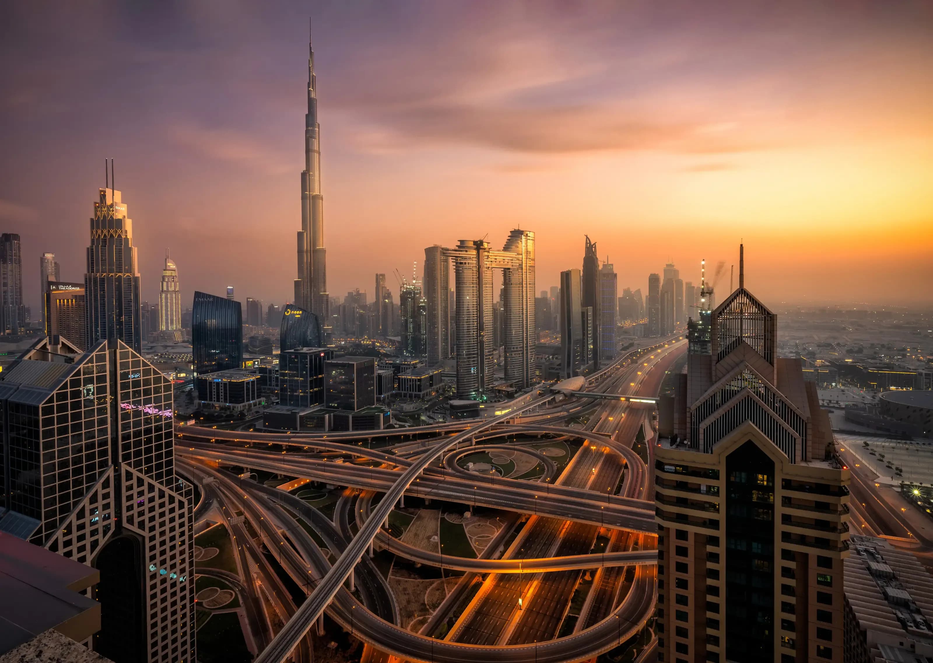 Dubai Skyline from hotel at blue hour sunset. Skycrapers can be seen as Burj Khalifa and Sheikh Zayed Road.