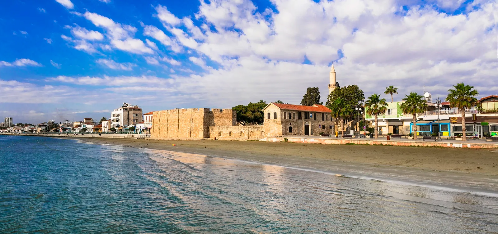  Capital city Larnaca. Charming downtown promenade with old fortress and minaret tower. Travel in Cyprus island. Larnaca town